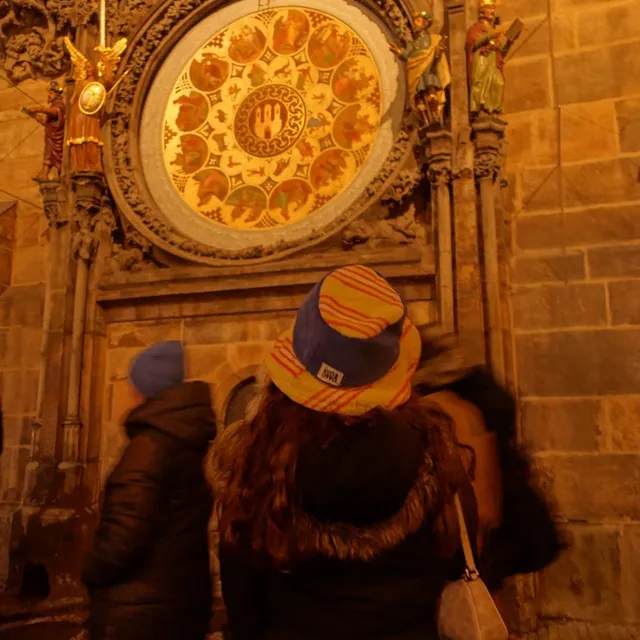 Charlotte under the astronomical clock in Prague, Czech Republic